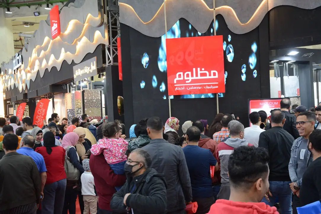Visitors reviewing home finishing choices at Ceramica Market