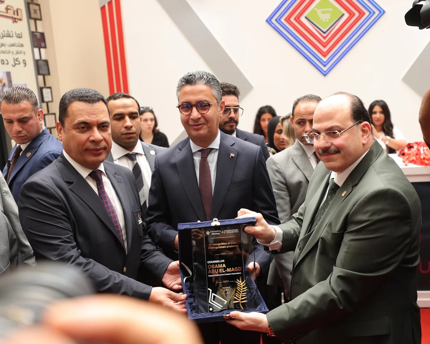 Officials presenting an award at Ceramica Market